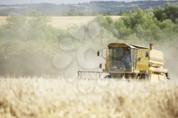 Royalty Free Photo of a Combine in a Field