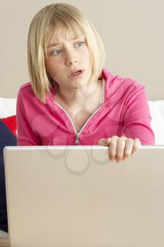 Royalty Free Photo of a Worried Girl With a Laptop