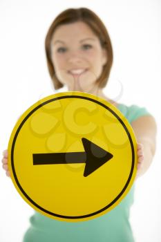 Royalty Free Photo of a Girl With an Arrow Sign