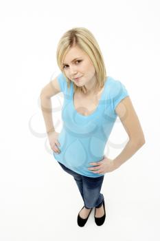 Royalty Free Photo of a Young Girl With Her Hands on Her Hips