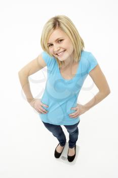 Royalty Free Photo of a Young Girl Standing With Her Hands on Her Hips