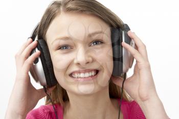 Royalty Free Photo of a Girl Listening to Headphones