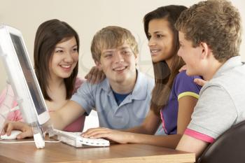 Royalty Free Photo of Teens on a Computer