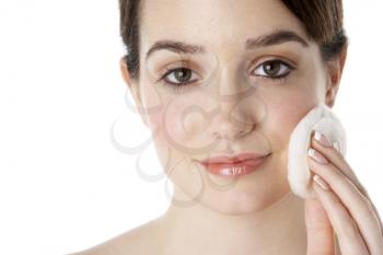 Royalty Free Photo of a Young Woman Putting on Powder