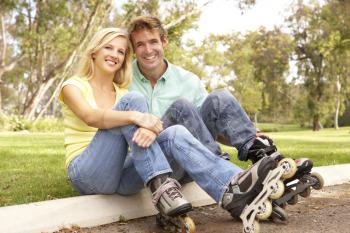 Royalty Free Photo of a Couple With Roller Blades