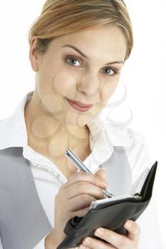 Blonde Businesswoman Writing In Diary