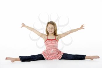 Young Girl In Gymnastic Pose Doing Splits