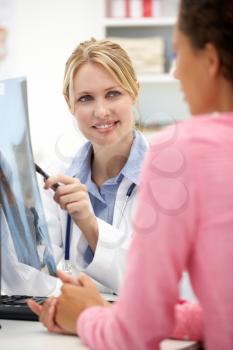 Young doctor with female patient