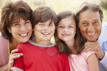 Hispanic grandparents and grandchildren outdoors