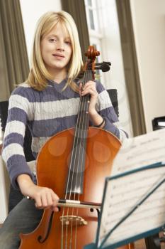 Girl playing cello at home