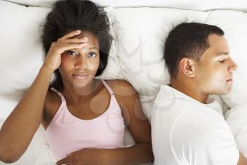 Couple In Bed With Relationship Difficulties