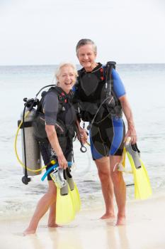 Senior Couple With Scuba Diving Equipment Enjoying Holiday