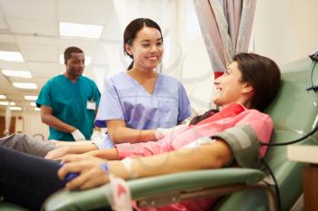 Blood Donors Making Donation In Hospital