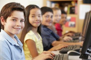 Schoolchildren working on computers
