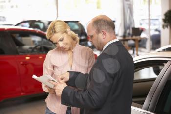Woman buying new car