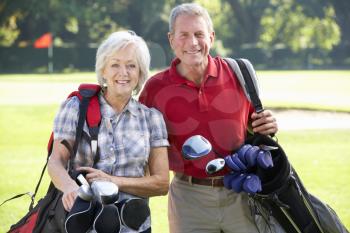 Senior couple on golf course