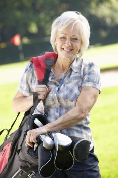 Senior woman on golf course