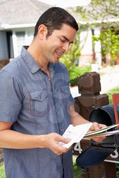 Hispanic Man Checking Mailbox