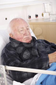 Senior man in hospital bed