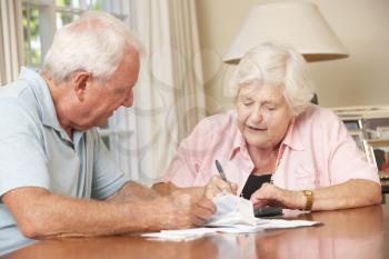 Senior Couple Concerned About Debt Going Through Bills Together