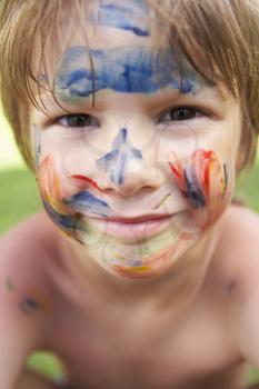 Head And Shoulders Portrait Of Boy With Painted Face