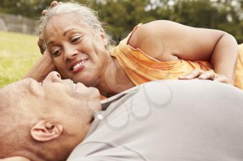 Romantic Senior Couple Relaxing In Park Together