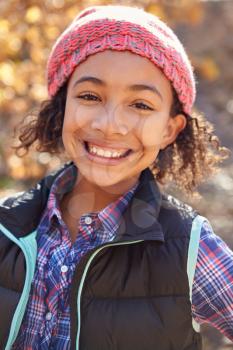 Portrait Of Girl Playing In Autumn Woods