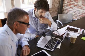 Businessmen Having Creative Brainstorming Meeting In Office