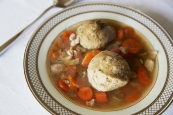 Jewish matzon ball soup served in a dish for passover