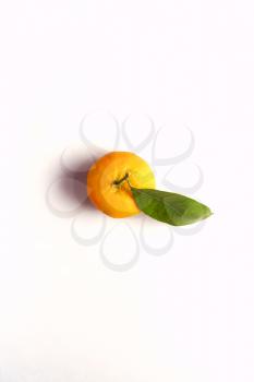 Overhead View Of Fresh Satsuma With Leaf On White Background