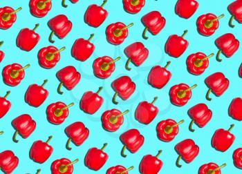 Graphic Background Pattern Of Red Peppers Against Blue Background