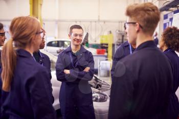 Group Of Students Studying For Auto Mechanic Apprenticeship At College