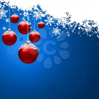 Christmas baubles on snowy background