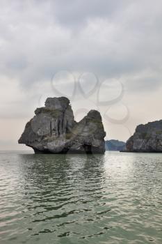 Foggy morning after a storm. The well-known island-rock Monkey Sawasdee Island in the Thai gulf