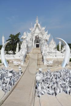 Incredibly perfect example of modern Thai architecture. Snow-white palace-museum, decorated with various sculptures in the traditional style

