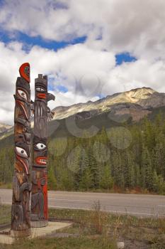 Totem American Indian columns on highway in Canada
