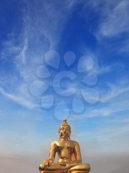 The famous Golden Triangle. Golden Buddha statue shining in the sun. Place on the Mekong River, which borders three countries - Thailand, Myanmar and Laos.