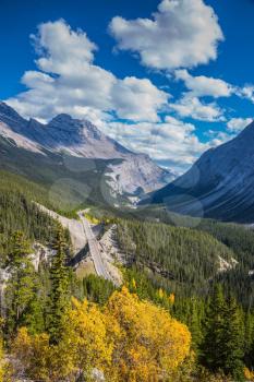 The Rocky Mountains of Canada, Banff National Park. Picturesque magnificent canyon in an autumn sunny day. Across the region to a canyon passes the excellent highway