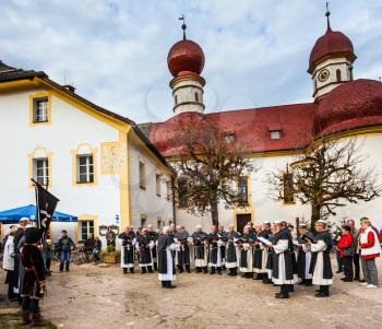 KONIGSSEE, BAVARIA, GERMANY - OCTOBER 4, 2013: Monastic Choir performs ritual chants.  Catholic chapel in Baroque style. Church of St. Bartholomew at Lake Königssee