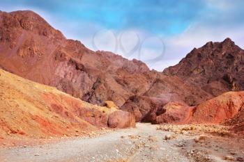 Warm day in January. Multi-colored mountains of Eilat, Israel. The road to the Pillars of Amram