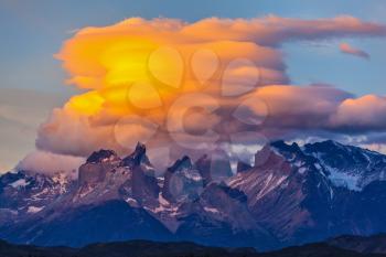 Incredible sunset in the  park Torres del Paine, Chile. Sharp curved peaks rocks Los Kuernos