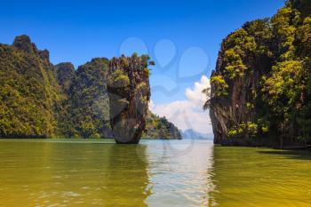  The tourist season in Thailand. Calm and warm Andaman Sea and the quaint island. James Bond Island