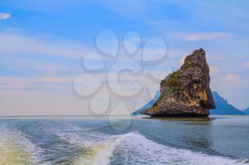  Fantastic beauty island-rock in the southern seas. The photo was taken from a fast sailing boat