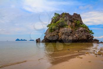 Unique Andaman Sea. Rocks of the island in the shallow waters and beautiful beaches with fine yellow sand