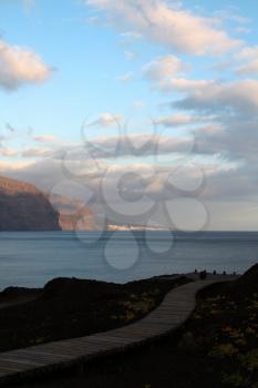 Path at Punta de Teno with Los Gigantes rocks and Atlantic ocean view at sunset light