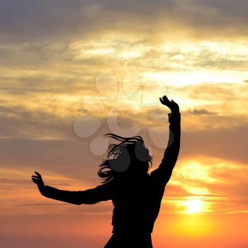 Happy for life concept with silhouette of woman enjoying sun
