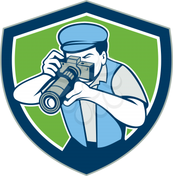 Illustration of a photographer shooting aiming with vintage camera set inside shield crest on isolated background done in cartoon style.
