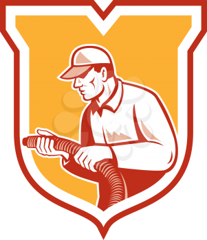 Illustration of a home insulation technician tradesman worker holding insulation pipe tubing set inside shield crest facing side done in retro woodcut style on isolated background.