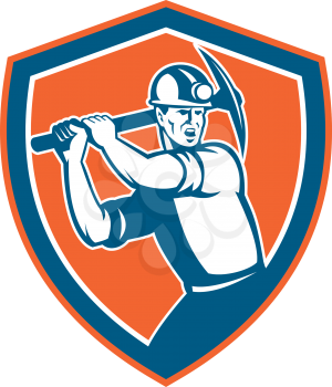 Illustration of a coal miner wearing hardhat with pick axe looking to the side set inside shield crest on isolated background done in retro style.