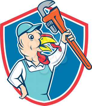 Illustration of a wild turkey plumber holding clutching monkey wrench looking to the side set inside shield crest done in cartoon style on isolated background.